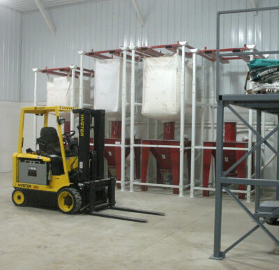 Rigid frame style bag stand with fork lift bracket.
