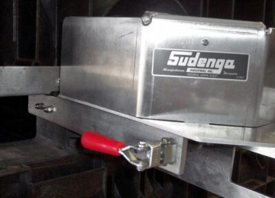 A reliable overcenter latch locks the opener securely on the seed box.