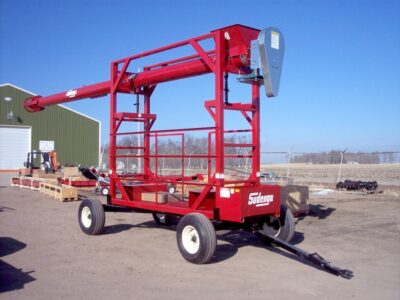 Auger style portable container loader for a 20' container.