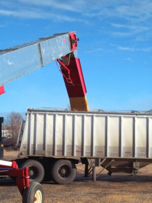Load waiting trailers quickly from flat storage piles with the 20,000 BPH Ultra Scoop.