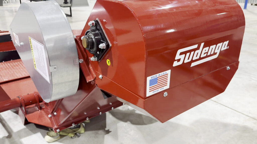 Here the head of the portable drive over hopper can be seen, featuring a decal signifying that this piece of ag equipment is made in America