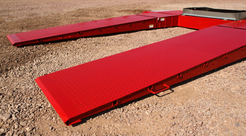 The spring-assisted ramps that are found on the Portable Drive Over Hopper
