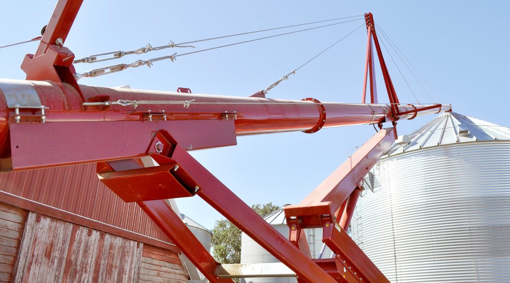 HOSS Portable Auger reaches up to the top of a grain bin