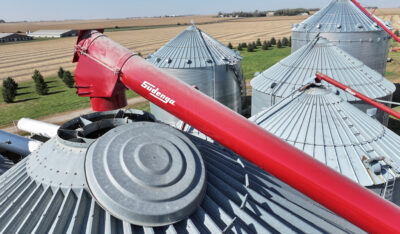 three Sudenga augers lined up to move grain into bins
