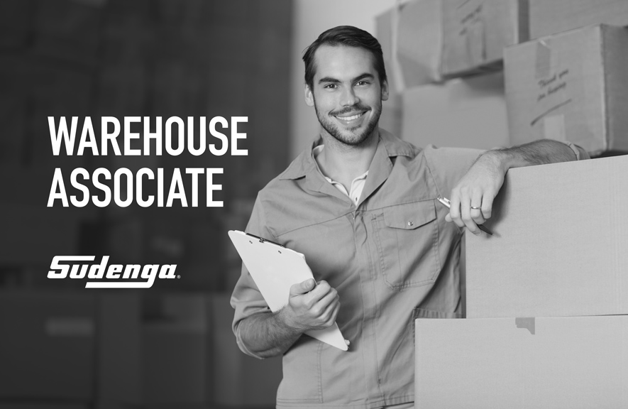 man standing next to box with clipboard